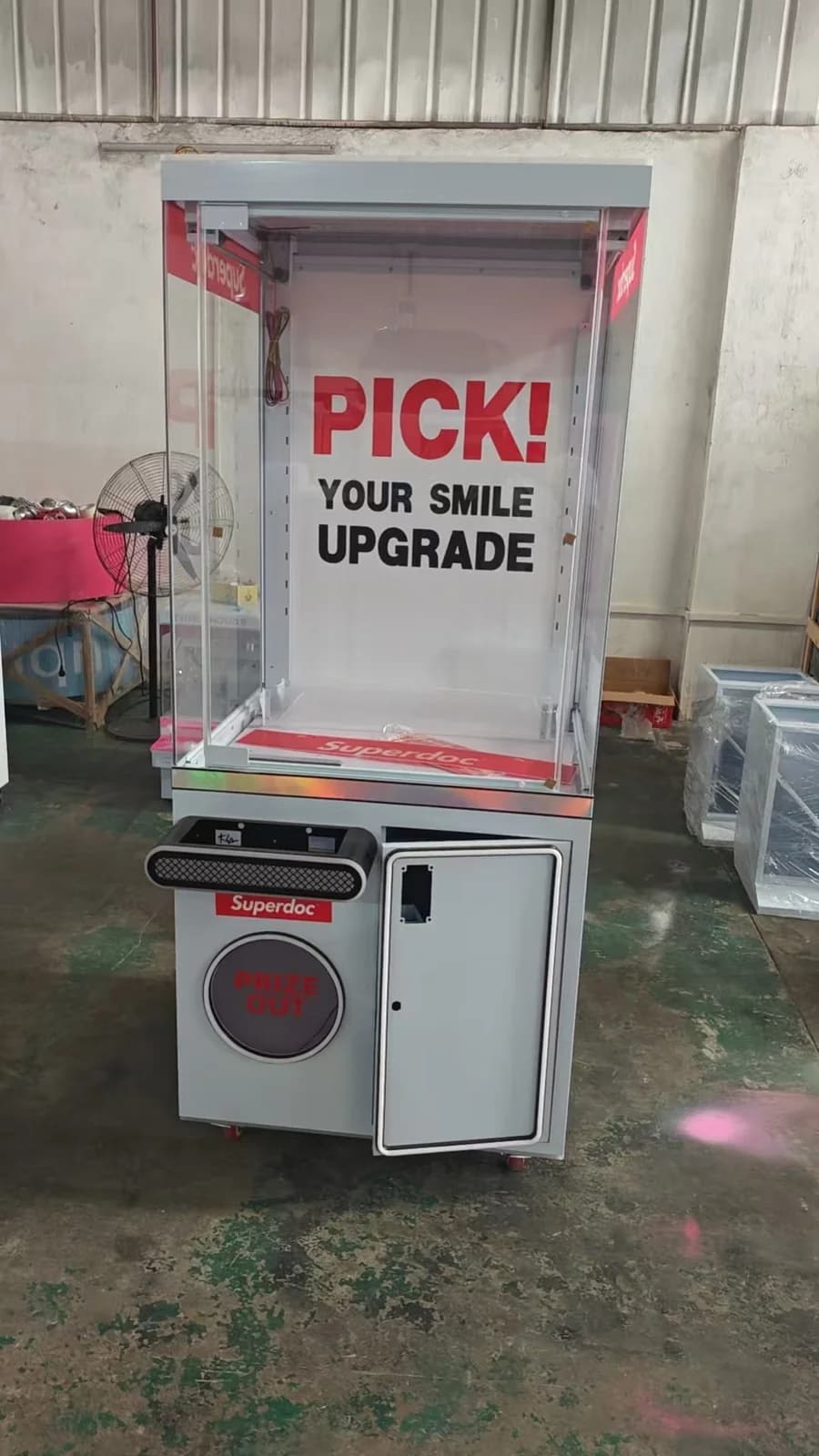 Large claw machine cabinet photographed in the factory