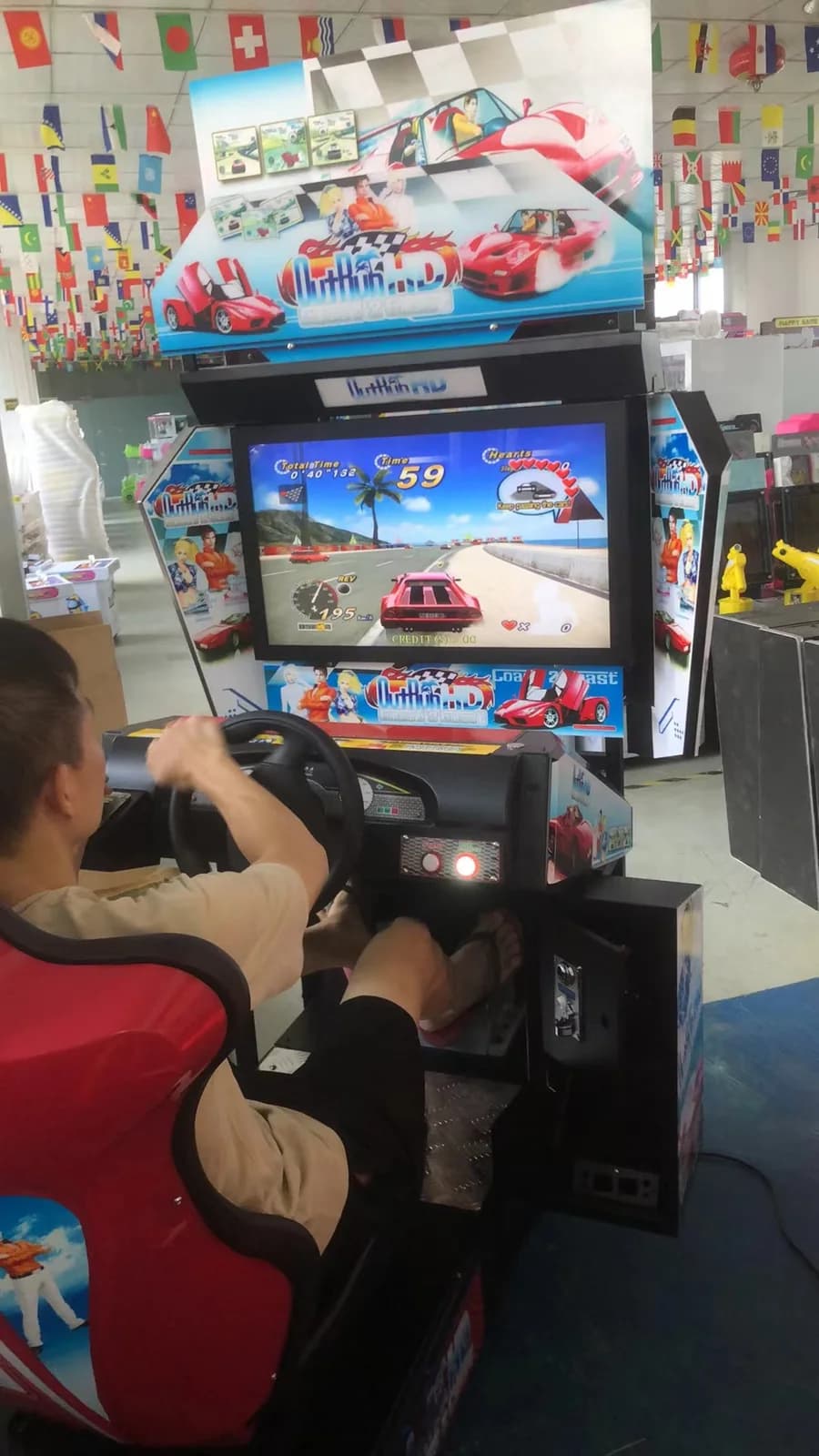 Player testing the 32-inch racing arcade simulator