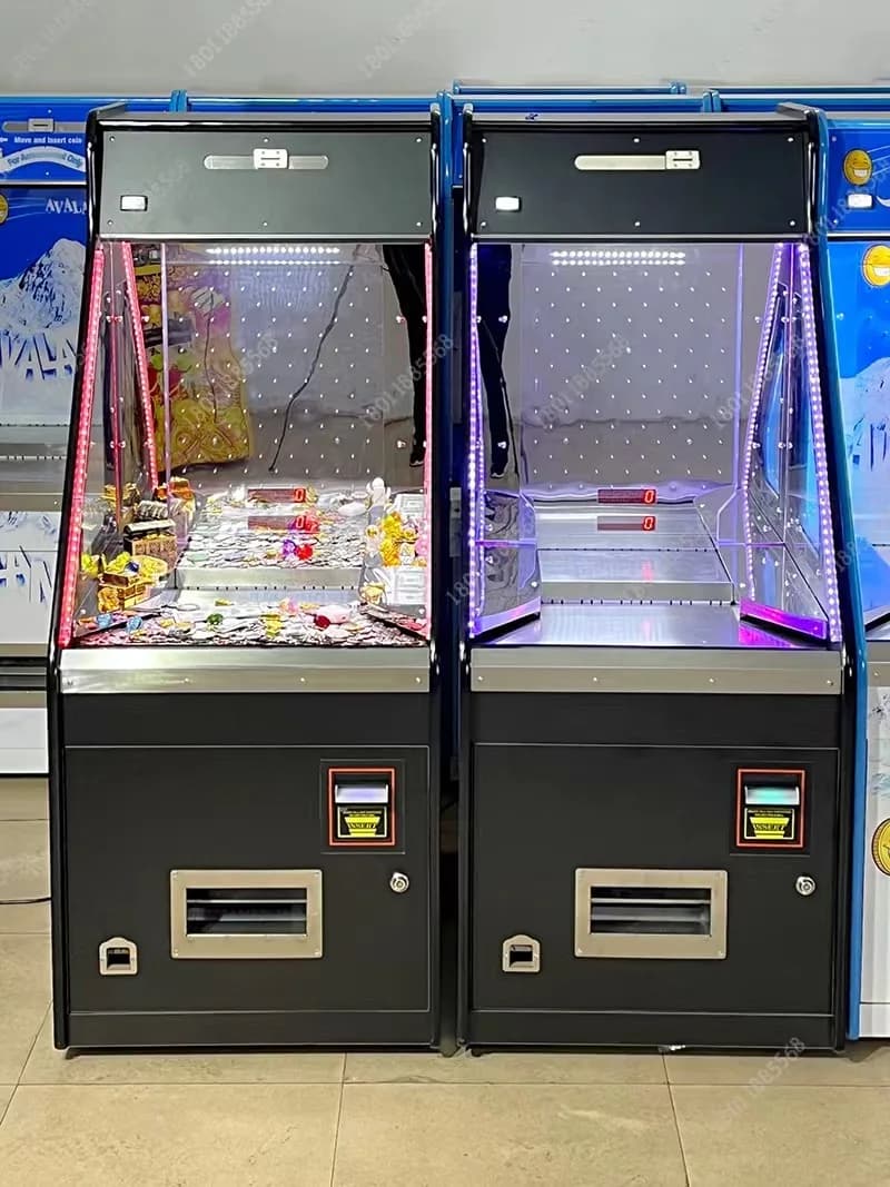 Two commercial coin pusher arcade machines