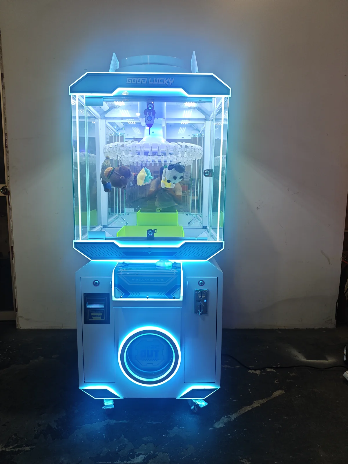 Commercial hanging prize claw machine with blue LED lighting