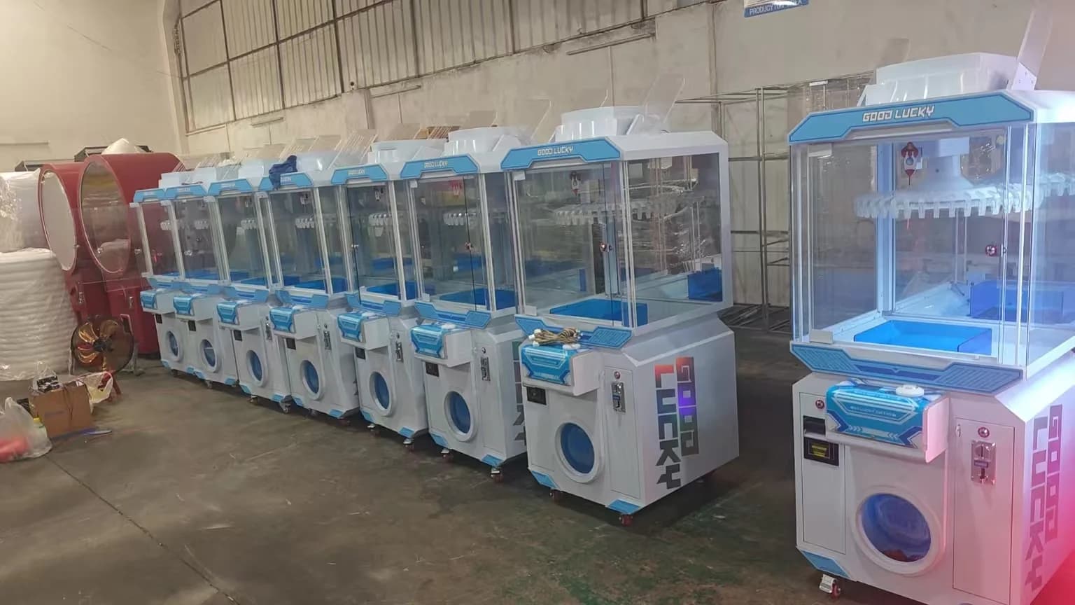 Factory lineup of hanging prize claw machines