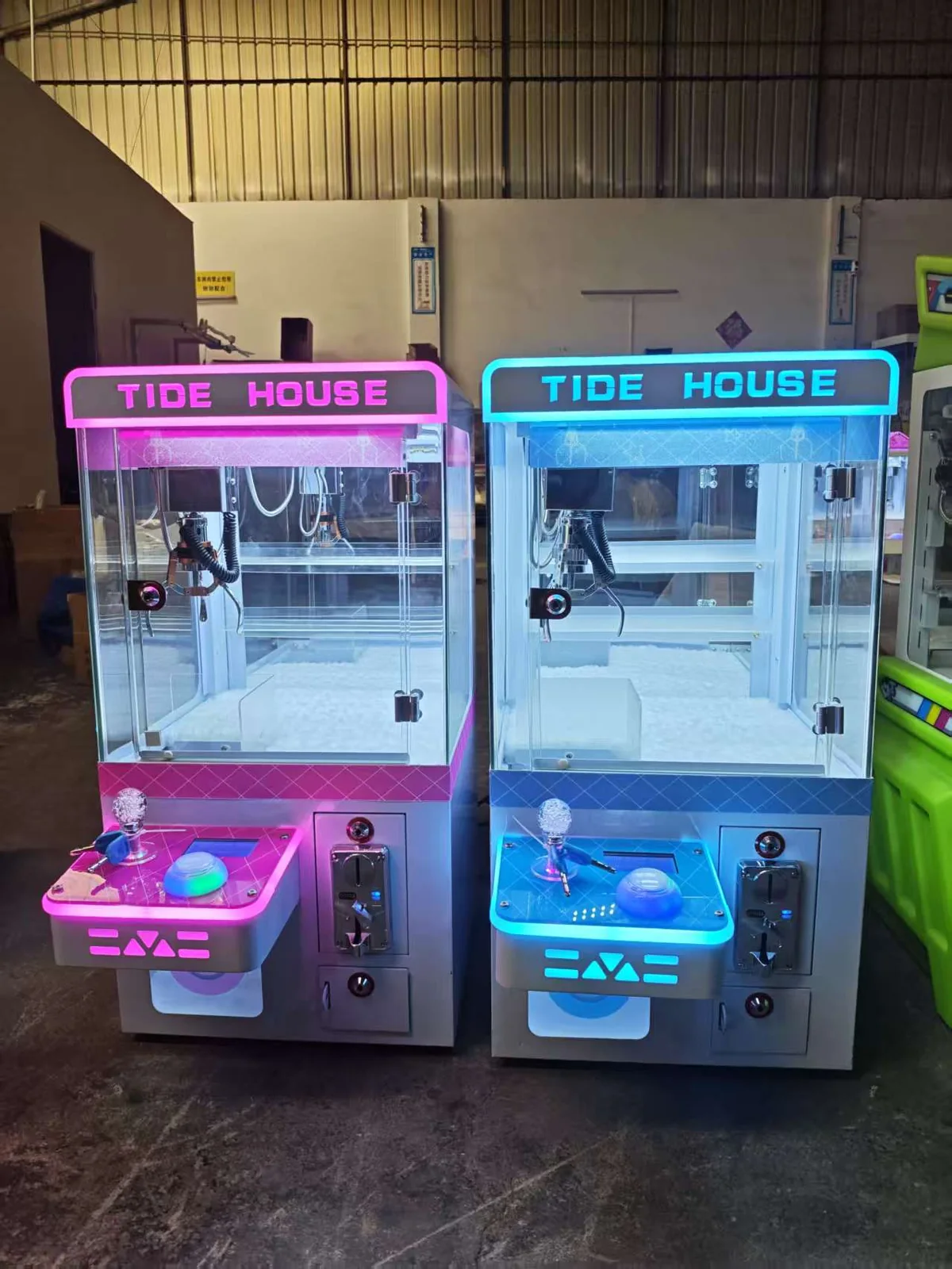 Blue and pink mini claw machines with LED headers