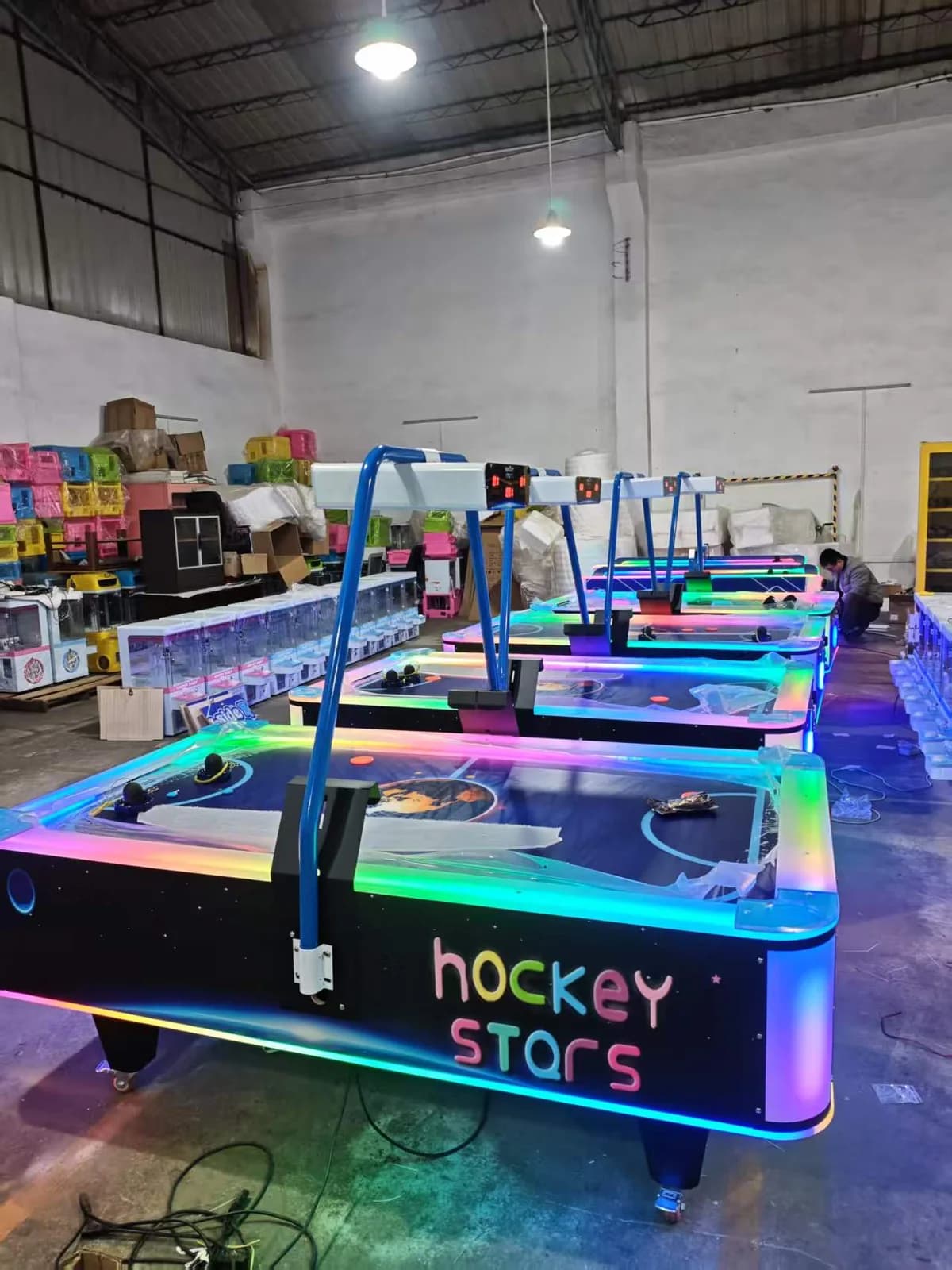 Front view of the illuminated two-player air hockey table